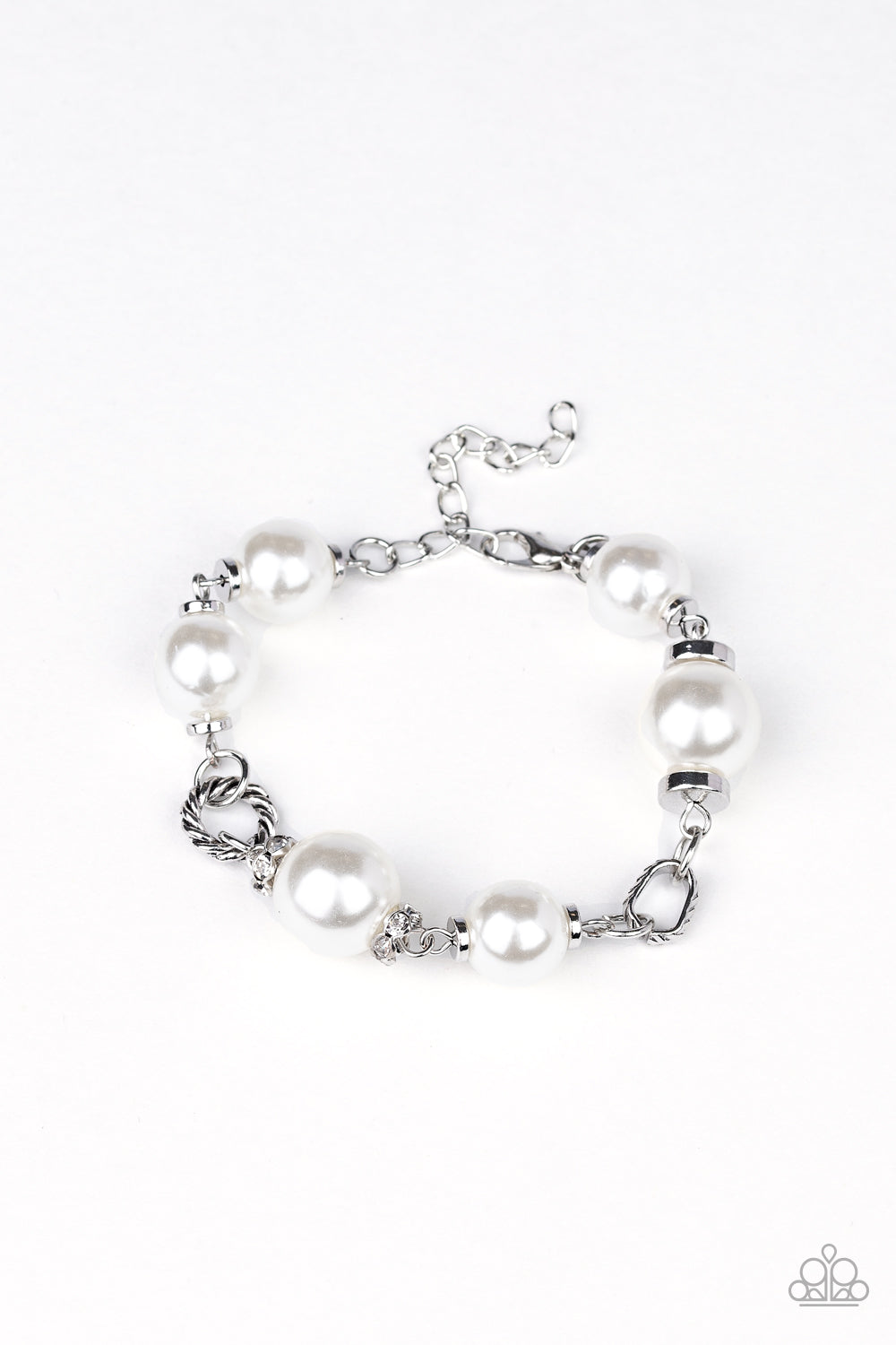 Boardroom Baller - White Pearl Bracelet - Paparazzi Accessories - A classic collection of white pearls, white rhinestone encrusted rings, and ornate silver accents link across the wrist for a timeless look. Features an adjustable clasp closure. Sold as one individual bracelet.