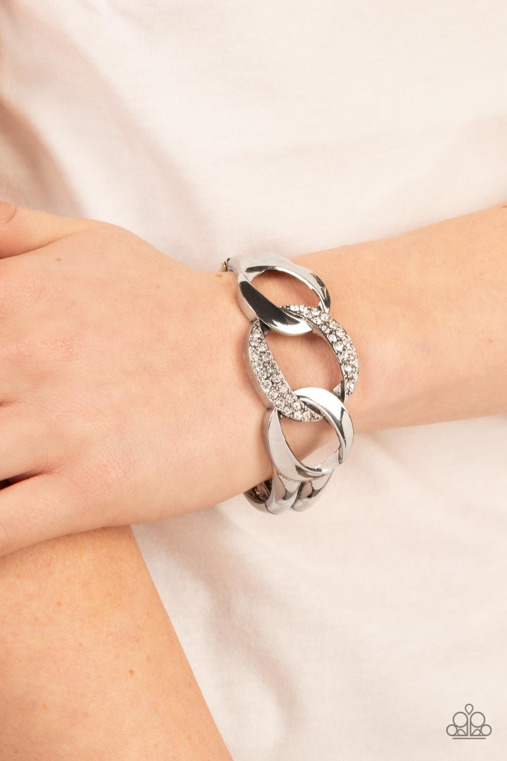 BOMBSHELL Squad - Sparkly Silver Hinged Cuff Bracelet  - Paparazzi Accessories - Trio of rounded square silver links, featuring a hammered texture, interlock into an unapologetic display. The centermost link is dotted with glassy rhinestones, creating a sparkly fashion around the wrist. Features a hinged closure. 