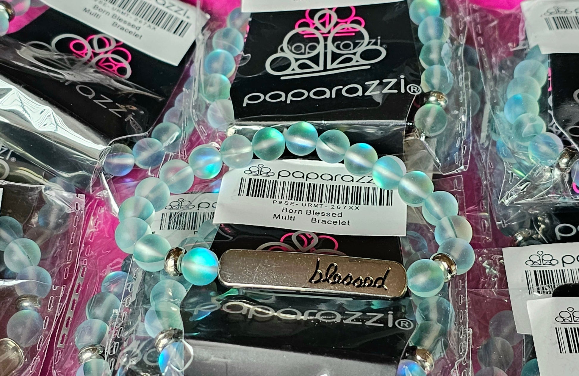 Born Blessed - Paparazzi Accessories - Infused with dainty silver accents, a collection of blue reflective natural stones are threaded along a stretchy band. A glistening silver frame engraved with the word, "blessed" adorns the center for a seasonal finish. Sold as one individual bracelet.