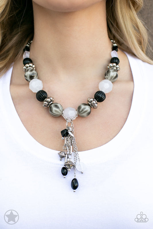 Break A Leg! - Black and White Necklace - Paparazzi Accessories - Smooth beads with a marbleized black and white swirl alternate with milky white and silver accents. A tassel of chains in various lengths is decorated with black, silver, and frosty pieces. Features an adjustable clasp closure. Sold as one individual necklace.