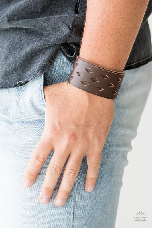 Bucking Bronco Brown - Men's Leather Bracelet - Paparazzi Accessories - Featuring airy diamond-shaped cutouts, a brown leather band is studded in place along a thicker brown leather band for a rustic look. Features an adjustable snap closure. Sold as one individual bracelet.