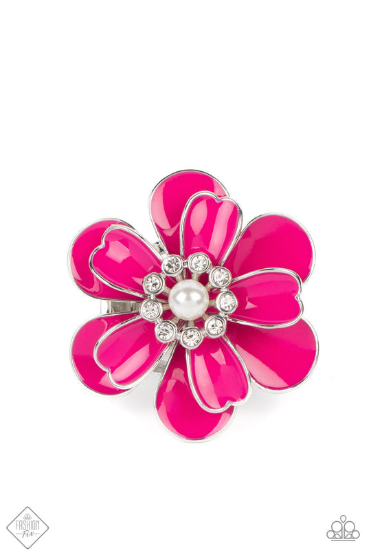 Budding Bliss - Pink Flower Ring - Paparazzi Accessories - An exaggerated pink flower with layers of petals blooms atop the finger in a vibrant display. A white pearl encircled by tiny white rhinestones adds a touch of whimsical sparkle to the design. Features a stretchy band for a flexible fit. Sold as one individual ring.