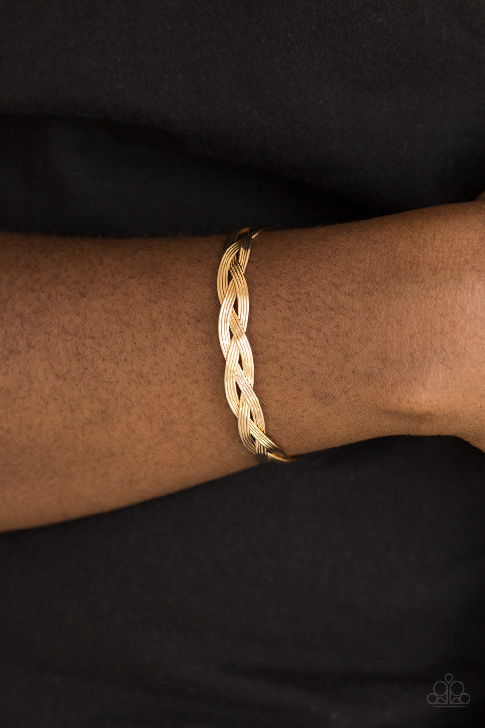 Business As Usual - Gold Cuff Bracelet - Paparazzi Accessories - Glistening gold wires braid across the wrist, coalescing into a dainty cuff. Sold as one individual bracelet.Perfect for any occasion or an everyday look. Shop the gold collection for matching accessories.
