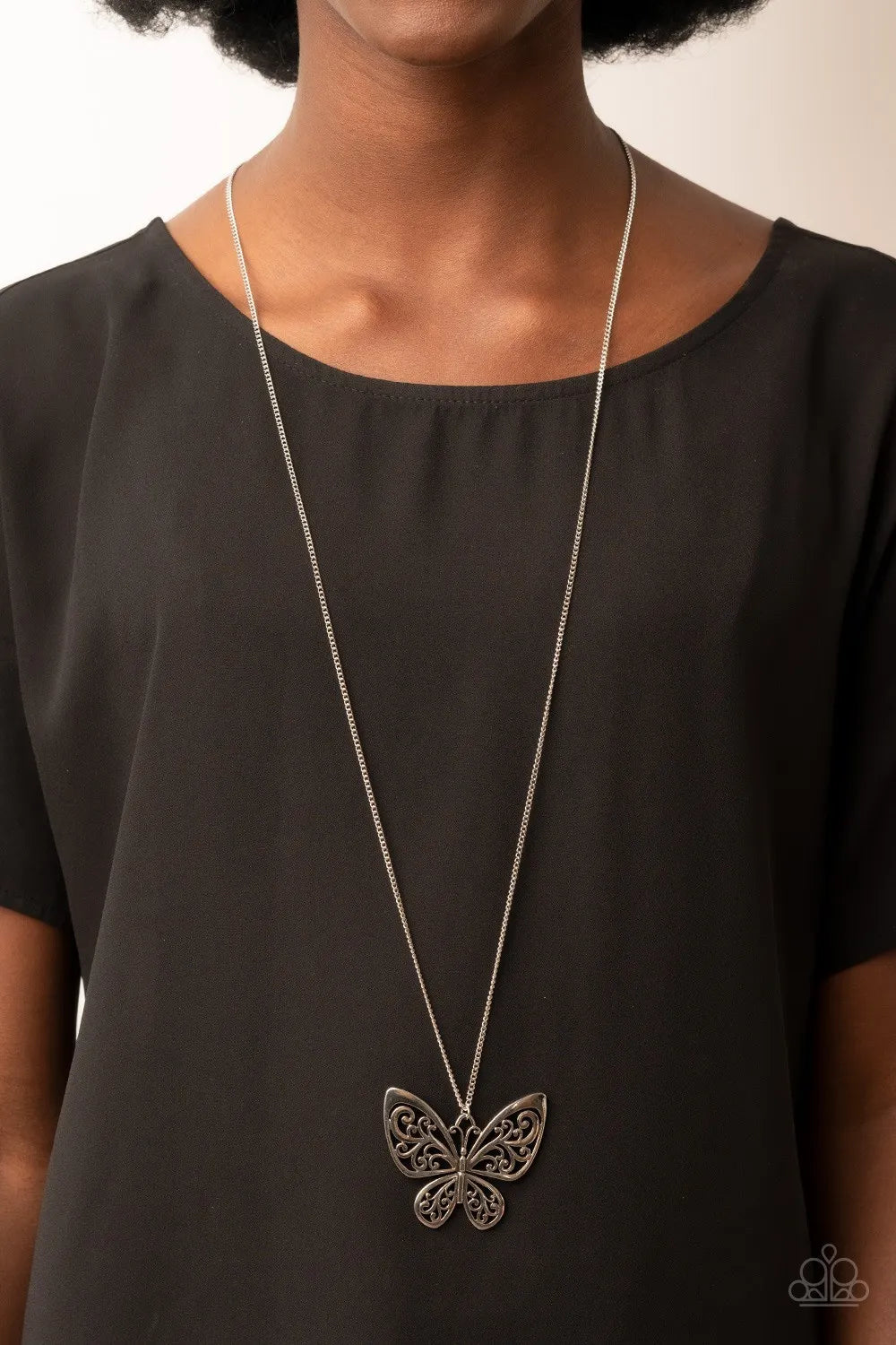 Butterfly Boutique - Silver Necklace - Paparazzi Accessories - Filled with frilly filigree details, a rustic silver butterfly flutters from the bottom of an extended silver chain for a whimsical fashion. Features an adjustable clasp closure.  Sold as one individual necklace.