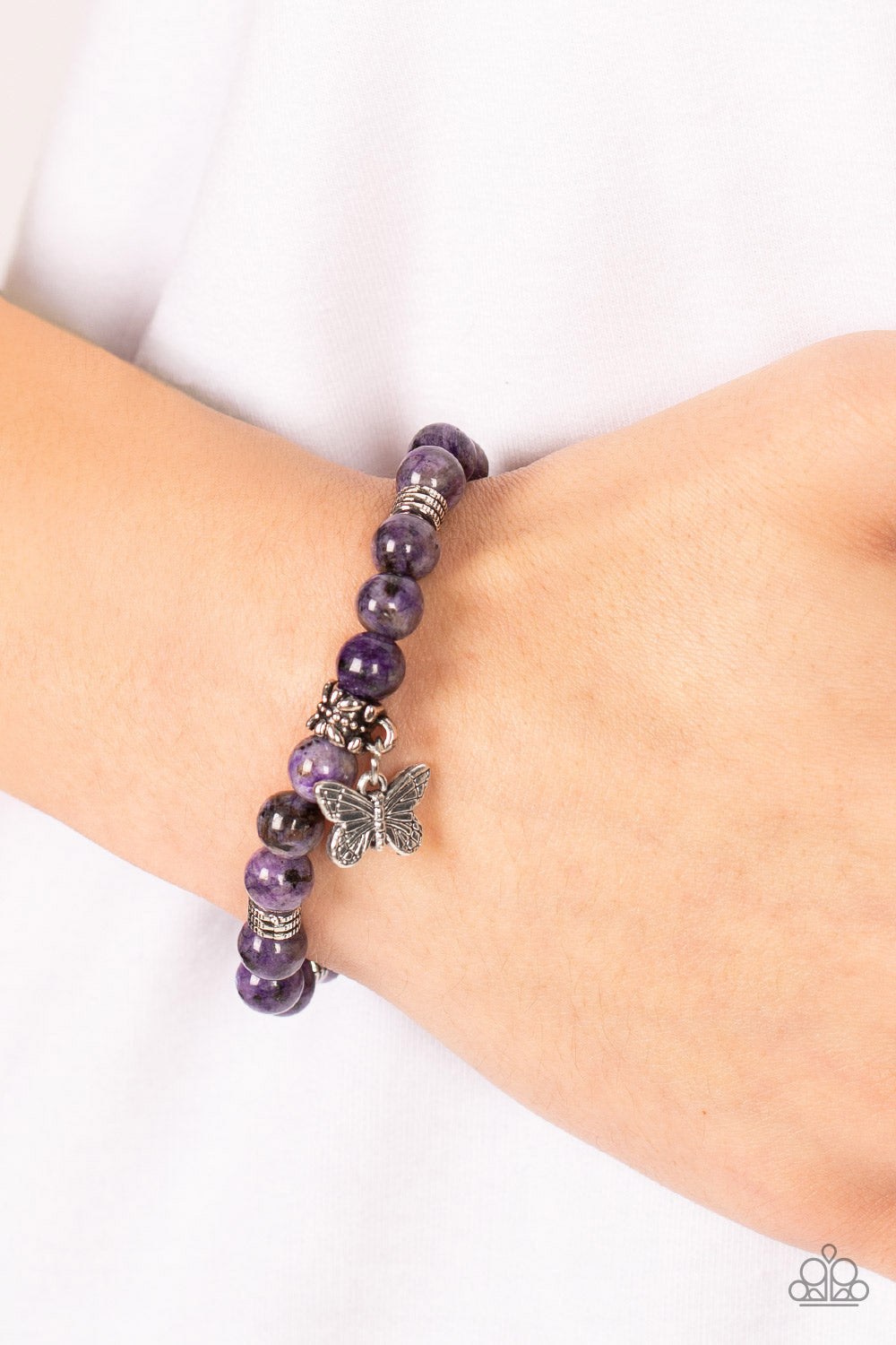 Butterfly Nirvana - Purple Amethyst - Silver Charm - Stretchy Bracelet Paparazzi Accessories - Silver butterfly charm, textured silver accents and amethyst stone beads are threaded along stretchy bands around the wrist for a whimsical style bracelet. Bejeweled Accessories By Kristie - Trendy fashion jewelry for everyone -