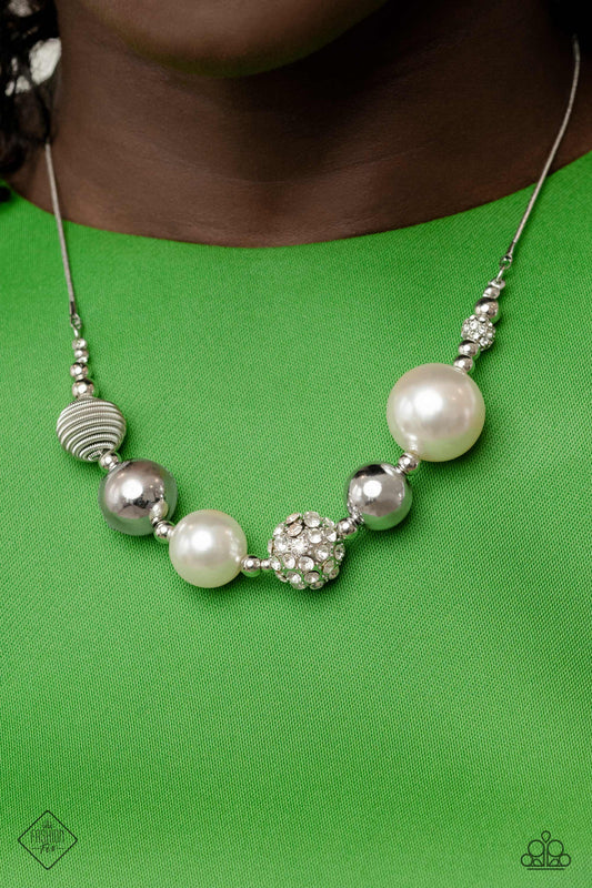 Caliber Choreographer - White Pearl and Silver Necklace - Paparazzi Accessories - Exaggerated white pearls and silver beads, silver studs, a white rhinestone-encrusted sphere, and a silver ball with textured spirals dance along the collar, connecting to a silver serpentine chain in a showcase of glitz and elegance.