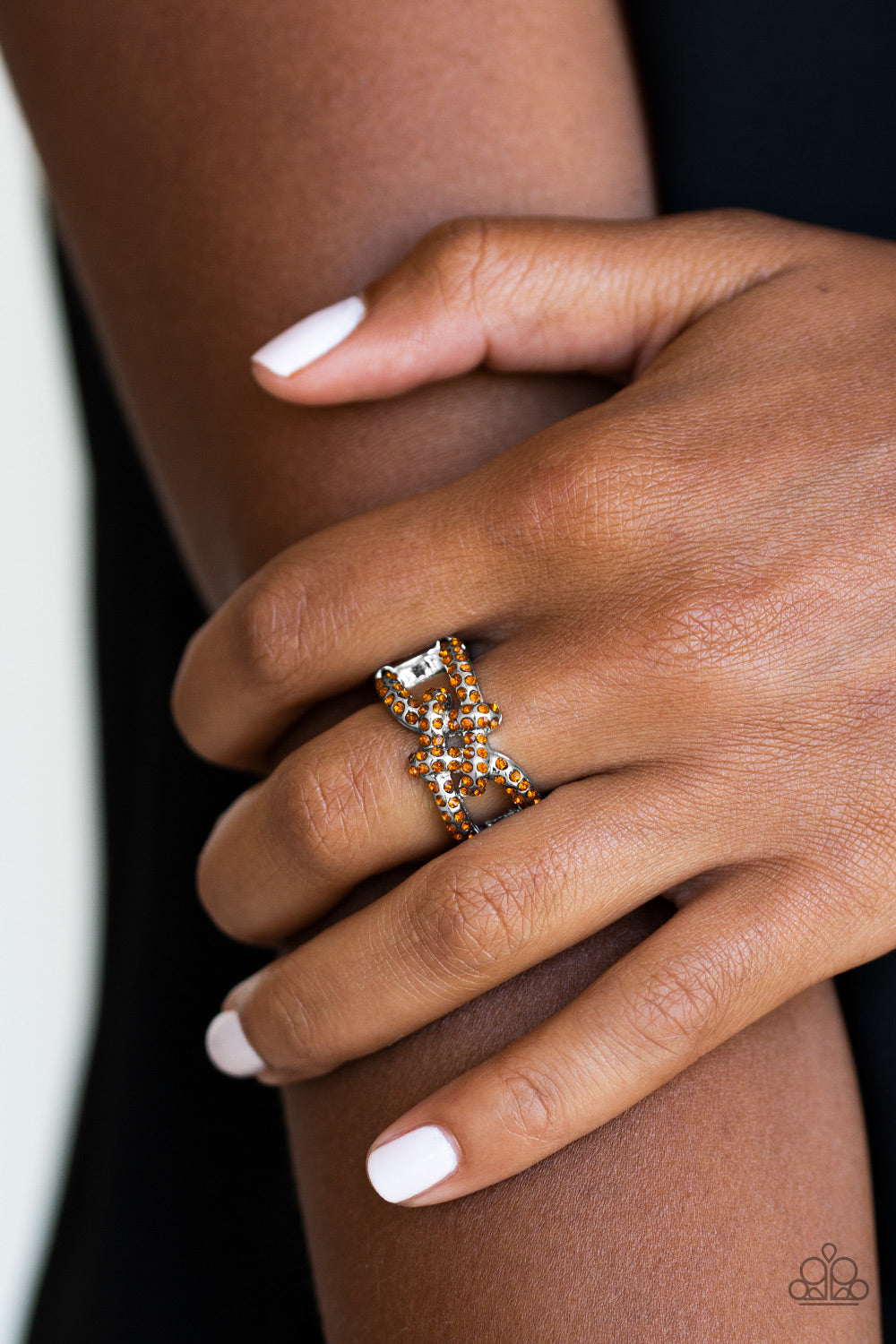 Can Only Go UPSCALE From Here - Brown and Silver Ring - Paparazzi Accessories - Encrusted in glittery rhinestones, shimmery silver bars crisscross across the finger, coalescing into a bold square knot atop the finger. Features a stretchy band for a flexible fit.