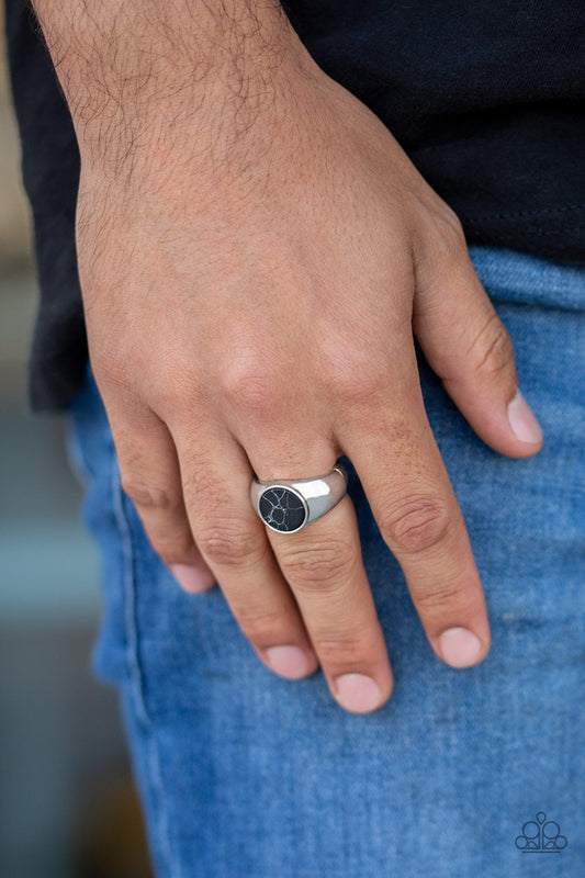 Carbon Print - Black and Silver - Men's Ring - Paparazzi Accessories - Featuring a faux marble finish, a flat black stone is pressed into the center of a classic silver band. Features a stretchy band for a flexible fit. Sold as one individual ring.