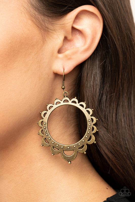Casually Capricious - Brass Fashion Earrings - Paparazzi Jewelry - Bejeweled Accessories By Kristie - Studded petal-like frames radiate out from an antiqued brass hoop, coalescing into a whimsical sunburst earrings.