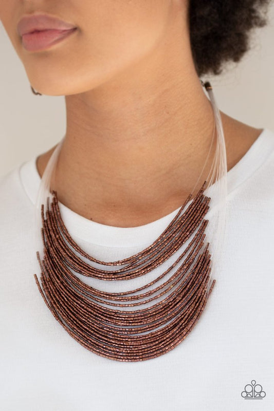 Catwalk Queen - Copper Seed Bead Necklace - Paparazzi Accessories - Strand after strand of metallic copper seed beads fall together to create a bold statement piece. Features an adjustable clasp closure.