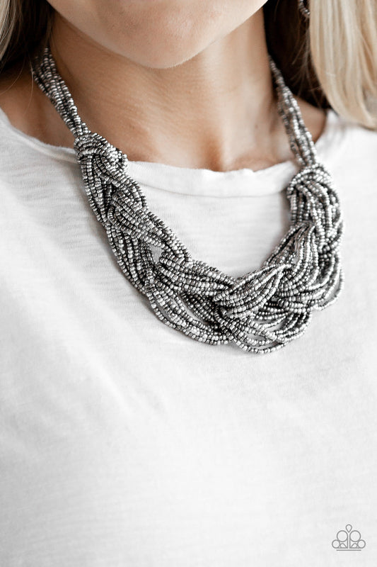 City Catwalk - Silver Seed Bead Necklace - Paparazzi Accessories - Brushed in a flashy finish, countless strands of silver and gunmetal seed beads weave into a bulky square braid below the collar for a glamorous look. Features an adjustable clasp closure. Sold as one individual necklace.