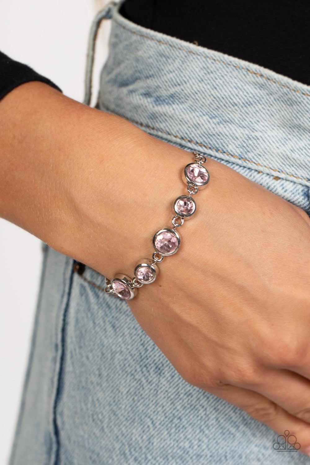 Classically Cultivated - Pink and Silver Bracelet - Paparazzi Accessories - Varying sizes of classic, round, brilliant-cut pink rhinestones set in thick, circular, silver frames link together around the wrist with glamorous glimmer. The rhinestones attach to a dainty strand of silver snake chain that wraps around the wrist in a refined finish. Features an adjustable lariat sliding bead closure. Sold as one individual bracelet.