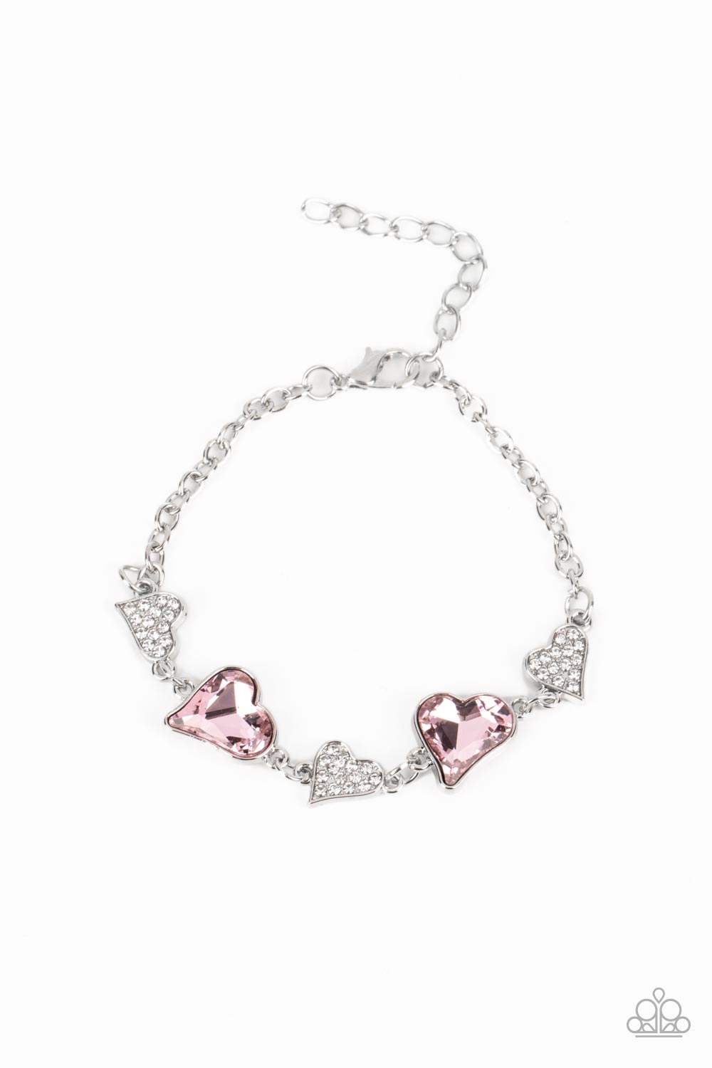 Cluelessly Crushing - Pink and Silver Heart Bracelet - Paparazzi Accessories - An asymmetrical collection of hearts coalesce around the wrist in this flirty centerpiece. Three of the silver hearts are encrusted with dainty white rhinestones, while the other two heart frames boast soft, pink gems for a sparkly finish. Features an adjustable clasp closure. Sold as one individual bracelet.