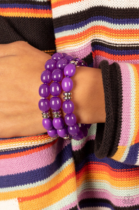 Coastal Coastin - Purple and Silver Stetchy Bracelet - Paparazzi Accessories - Silver accents rows of glassy opaque and acrylic purple beads are threaded along stretchy bands around the wrist resulting in vivacious layer bracelets.