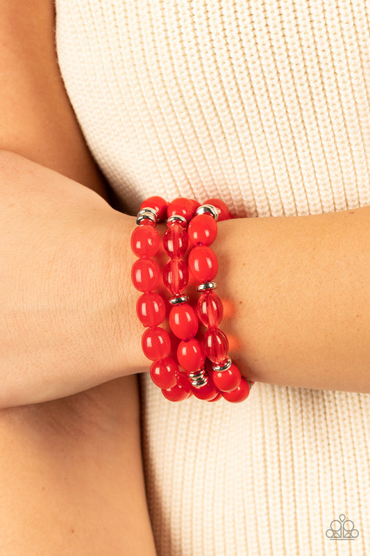 Coastal Coastin - Red Stretchy Bracelets - Paparazzi Accessories - Infused with silver accents, rows of glassy, opaque and acrylic red beads are threaded along stretchy bands around the wrist, resulting in fiery layers.