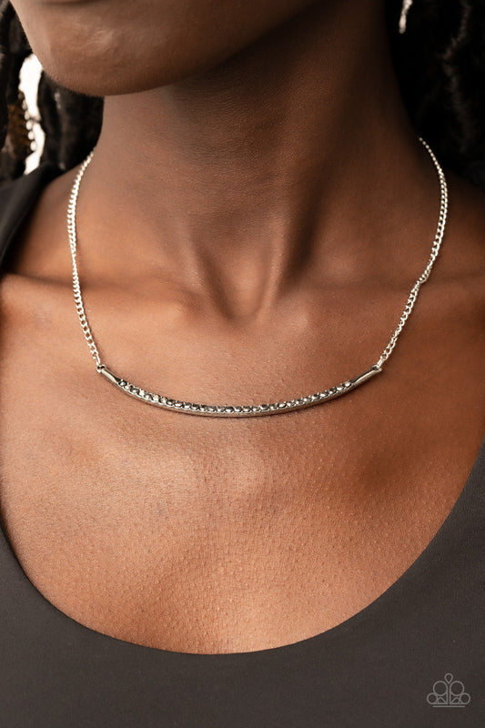 Collar Poppin Sparkle - Silver Fashion Necklace - Paparazzi Accessories - Encrusted in smoky hematite rhinestones, a curved silver bar bows below the collar for a smoldering style. Features an adjustable clasp closure.