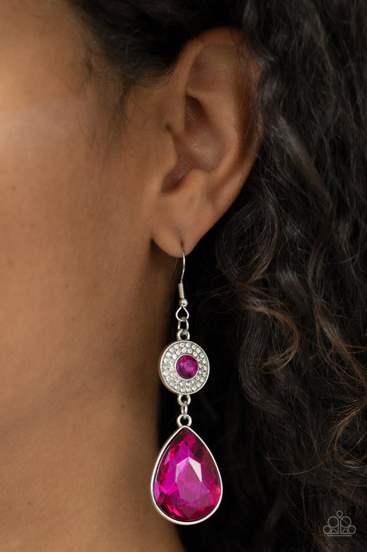 Collecting My Royalties - Fuchsia Pink and Silver Earrings - Paparazzi Accessories - Dotted with a solitaire Fuchsia Fedora rhinestone, a white rhinestone encrusted silver disc gives way to an oversized teardrop Fuchsia Fedora gem, resulting in a glamorous lure. Earring attaches to a standard fishhook fitting. Sold as one pair of earrings.