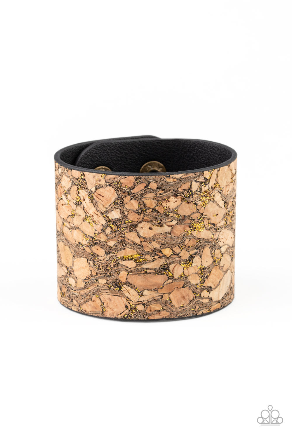 Cork Congo - Brass and Cork Bracelet - Paparazzi Accessories - Pieces of cork have been plastered across the front of a black leather band, creating an earthy look around the wrist. Specks of glittery brass accents are sprinkled across the front for a flashy finish. Features an adjustable snap closure. Sold as one individual bracelet.