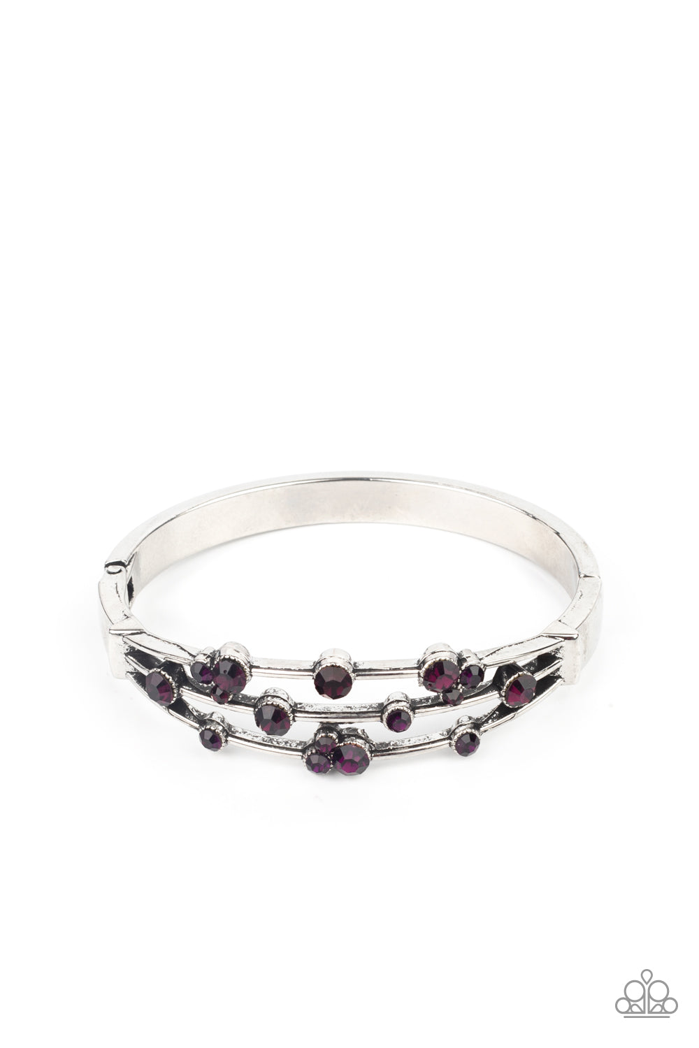 Cosmic Candescence - Purple and Silver Hinge Closure Bracelet - Paparazzi Accessories - 
A smattering of glittery purple rhinestones adorn three silver bars that coalesce into a versatile silver cuff-like bangle around the wrist. Features a hinged closure. Sold as one individual bracelet.
