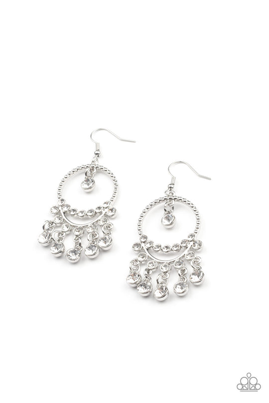 Cosmic Chandaliers - White and Silver Earrings - Paparazzi Accessories - Glassy white rhinestones swing from a row of glittery white rhinestones that attach to the bottom of a studded silver hoop. An additional row of blinding white rhinestones bows across the display, adding extra sparkle to the glamorous chandelier. Earring attaches to a standard fishhook fitting. Sold as one pair of earrings.
