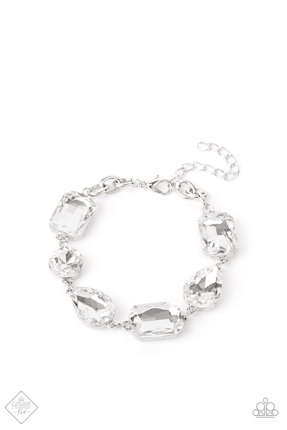 Cosmic Treasure Chest - White and Silver Bling Bracelet - Paparazzi Accessories - A collection of oversized round, teardrop, and emerald cut rhinestones delicately link around the wrist, creating a blinding statement piece. Features an adjustable clasp closure. Sold as one individual bracelet.