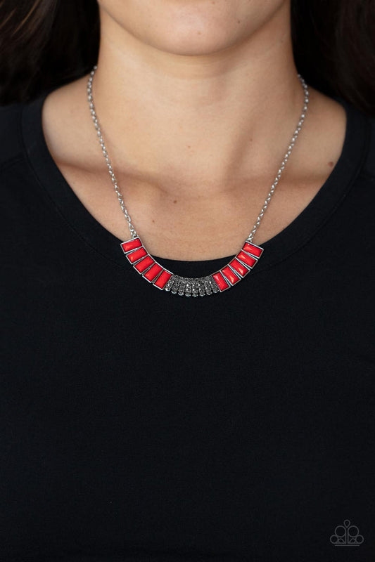 Coup de MANE - Red and Silver Fashion Necklace - Paparazzi Jewelry  - Bejeweled Accessories By Kristie - Stacked rows of hematite rhinestones and faceted emerald cut Fire Whirl beads coalesce into a colorful half moon pendant, creating a flamboyant pop of color below the collar.