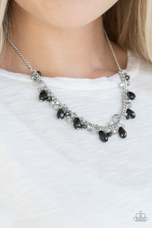 Courageously Catwalk - Silver and Black Necklace - Paparazzi Accessories - Featuring crystal-like and metallic opaque finishes, mismatched beading swings from a shimmery silver chain, creating a glamorous fringe below the collar. Features an adjustable clasp closure. Sold as one individual necklace.