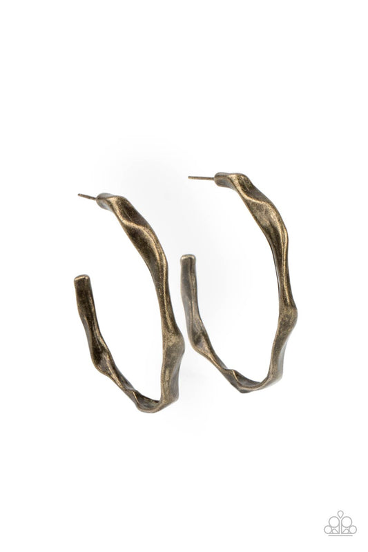 Coveted Curves - Brass Earrings - Paparazzi Accessories - Boldly hammered curves work their way around an antiqued brass hoop for an unexpected twist. Earring attaches to a standard post fitting. Hoop measures approximately 1 1/2 in diameter. Sold as one pair of hoop earrings.
