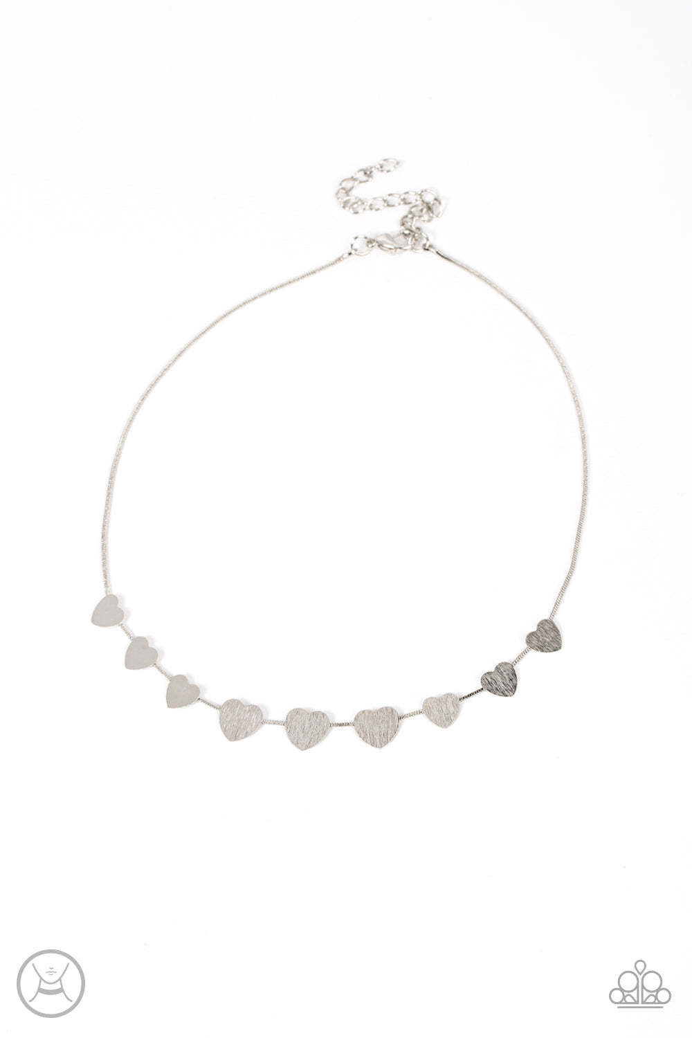 Dainty Desire - Silver Heart Choker Necklace - Paparazzi Accessories - A dainty collection of flat silver heart frames gradually increases in size along a shiny silver snake chain around the neck for a flirtatious fashion. Features an adjustable clasp closure. Bejeweled Accessories By Kristie - Trendy fashion jewelry for everyone -