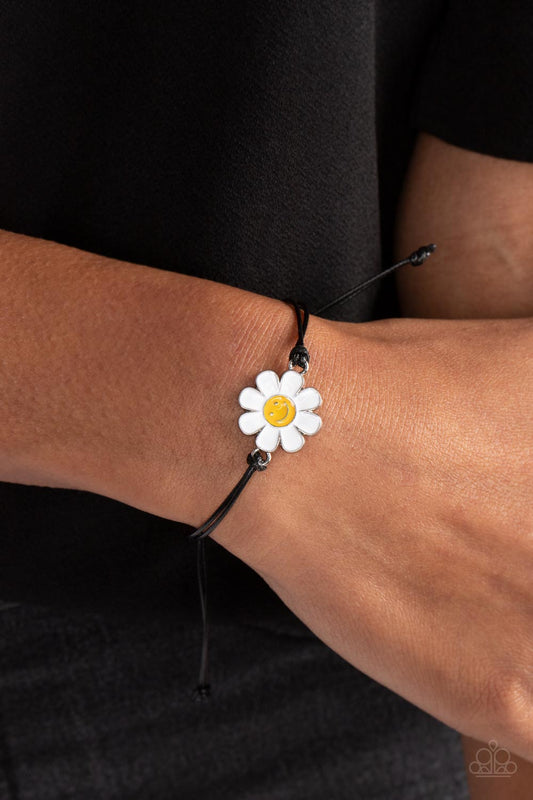 DAISY Little Thing - Black Floral Bracelet - Paparazzi Accessories - Held together and centered within soft black cording, a single daisy charm rests. Featuring a silver smiley face in its yellow center, this single flower provides a fashionably, minimalistic statement around the wrist.