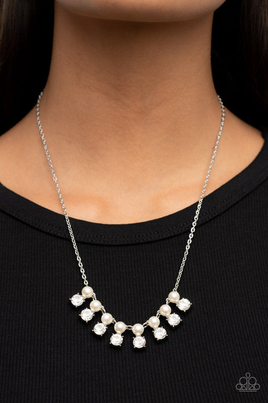 Dashingly Duchess - Pearl and Silver Necklace - Paparazzi Accessories - Encased in sleek silver fittings, pairs of white pearls and white rhinestones elegantly stack below the collar for a romantically refined flair. Features an adjustable clasp closure.