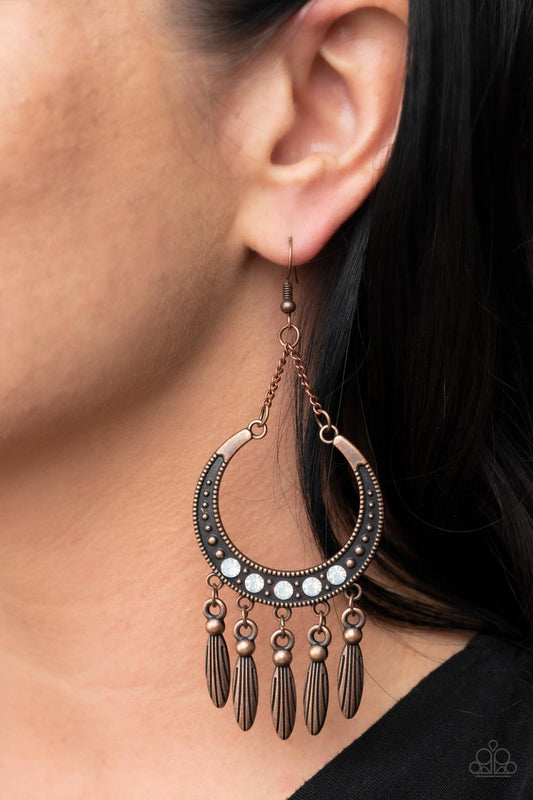 Day to DAYDREAM - Copper Earrings - Paparazzi Accessories - A row of opal rhinestones adorns the center of a studded copper half moon frame. Tassels of classic and textured copper beads cascade from the bottom of the frame, creating a dreamy fringe.