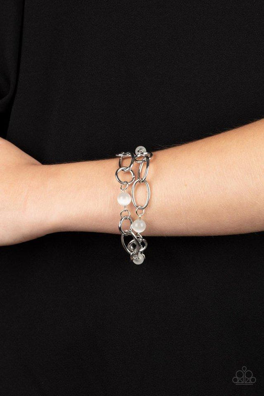 Delightfully Daydreamy - White - Silver  Bracelet - Paparazzi Accessories - Chunky silver links and glassy white cat's eye stone beads join into two dreamy layers around the wrist, creating a whimsical centerpiece. Features an adjustable clasp closure.