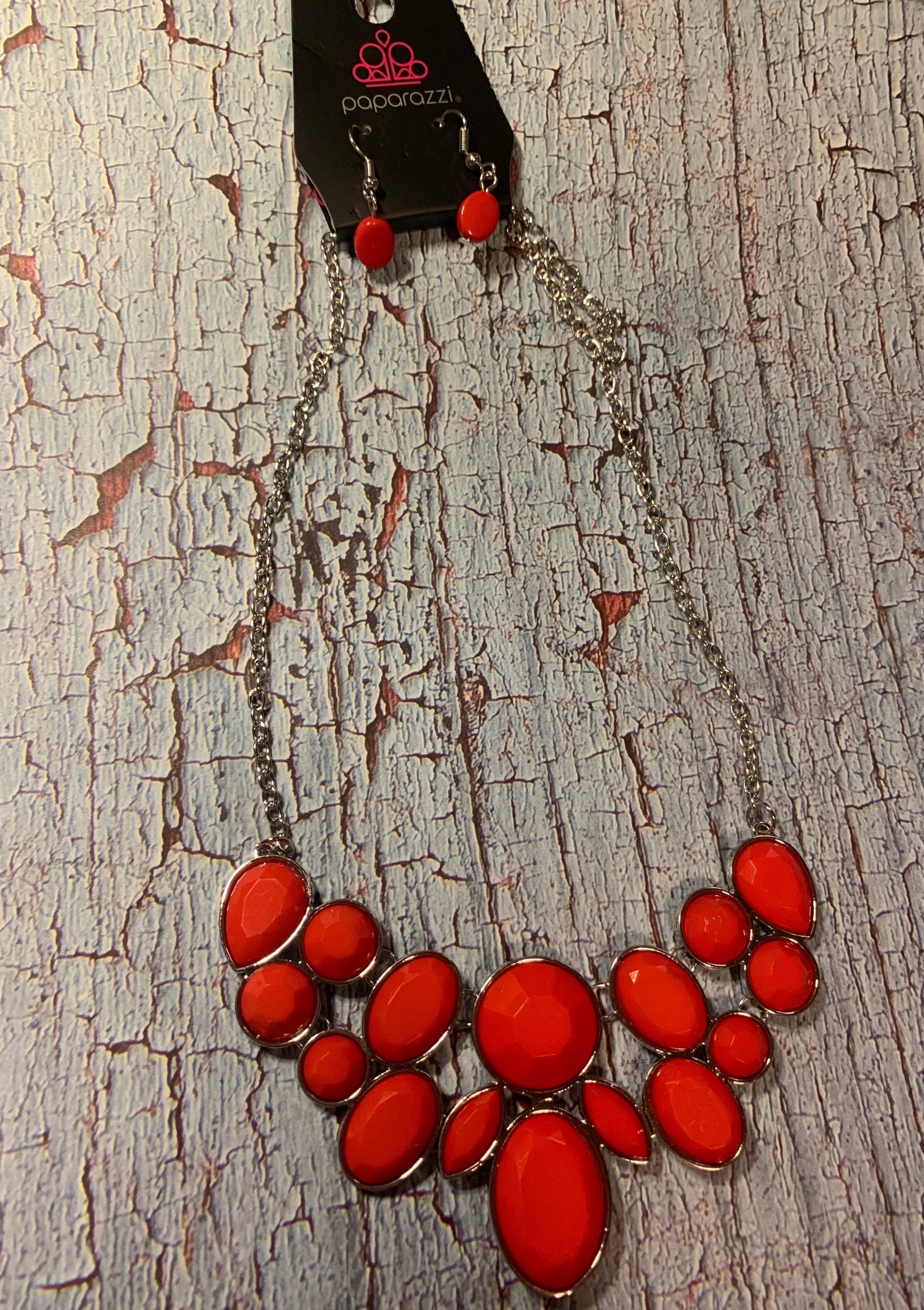 Demi-Diva - Red and Silver Necklace - Paparazzi Accessories - Bold red and silver fashion necklace. Featuring regal teardrop, oval, round and marquise style cuts, glittery red gems coalesce into a glittery pendant below the collar, creating a knockout pendant. Features an adjustable clasp closure. Sold as one individual necklace.