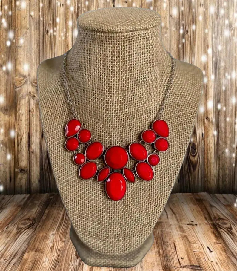 Demi-Diva Red and Silver Necklace - Paparazzi Accessories - Bold red and silver fashion necklace. Featuring regal teardrop, oval, round and marquise style cuts, glittery red gems coalesce into a glittery pendant below the collar, creating a knockout pendant.