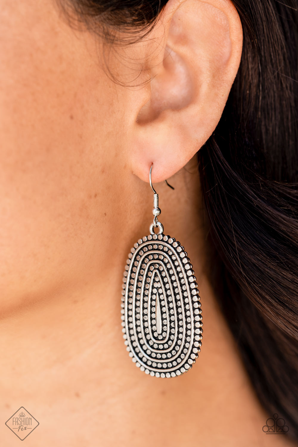 ​Desert Climate - Silver Fashion Earrings - Paparazzi Accessories - Rows of antiqued silver dotted texture radiate outward from an embossed center. The concentric lines create a rippling effect across the frame resulting in a rustic finish. Earring attaches to a standard fishhook fitting. Sold as one pair of earrings.