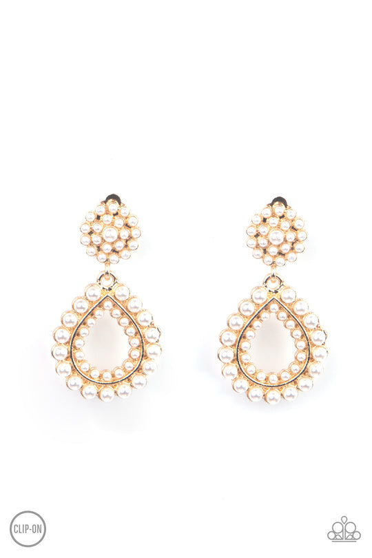 Discerning Droplets - Gold - White Pearls - Clip On Earrings - Paparazzi Accessories - Droplets of pearls dot the surface of a gold teardrop frame that suspends from a round pearl encrusted disc for a classic finish. Earring attaches to a standard clip-on fitting. Sold as one pair of clip-on earrings.
