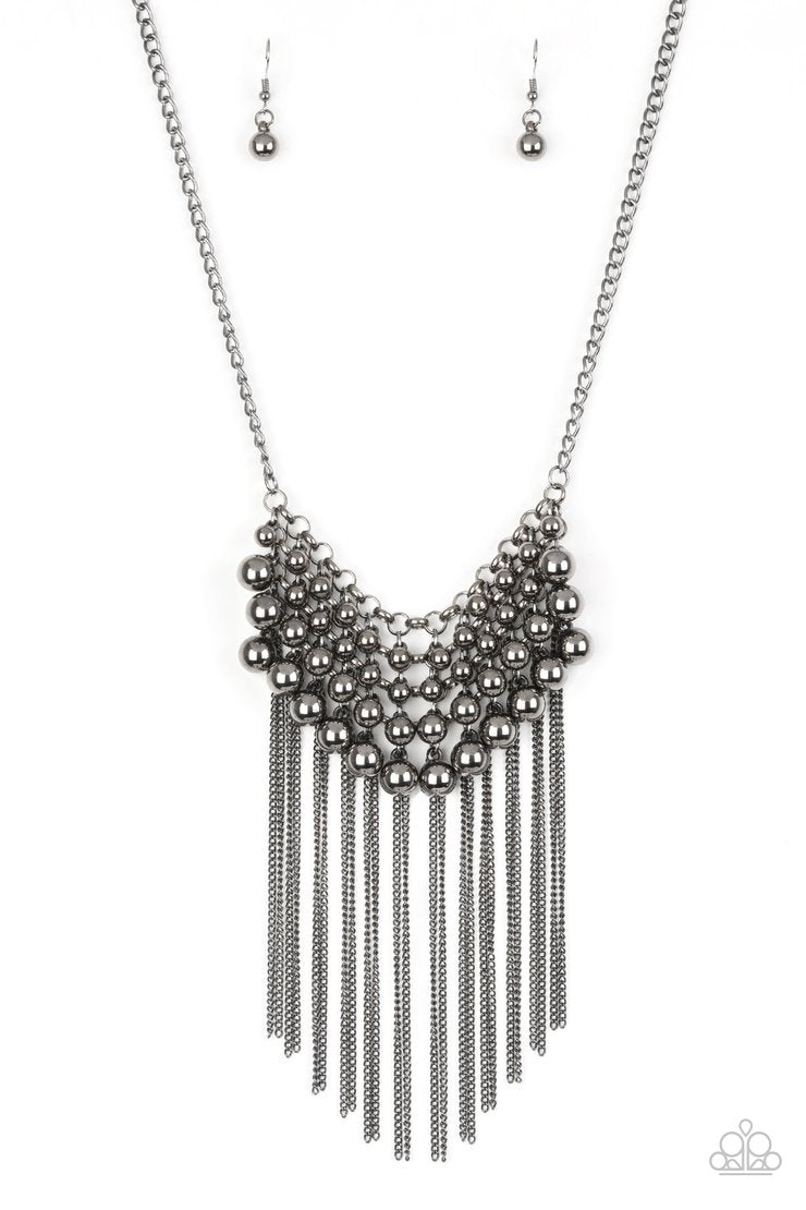 DIVA-de and Rule - Black Metal Necklace - Paparazzi Accessories - Gradually increasing in size, glistening gunmetal beads swing from a net of interlocking gunmetal links. Shimmery gunmetal chains stream from the bottom of the beaded fringe for an edgy finish. Features an adjustable clasp closure.