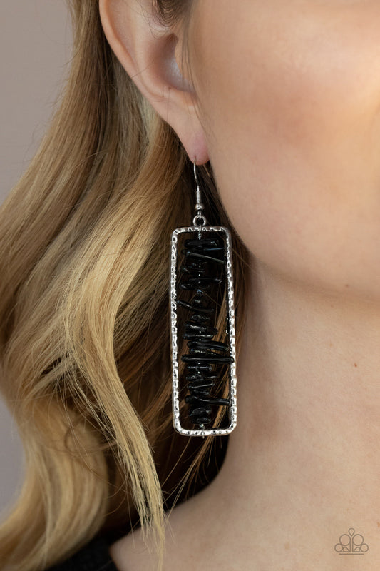 Dont QUARRY, Be Happy - Black Rock - Silver Earrings - Paparazzi Accessories - 
Bits of black rock are threaded along a metal rod inside a hammered silver rectangle, creating an earthy frame. Earring attaches to a standard fishhook fitting.
Sold as one pair of earrings.
