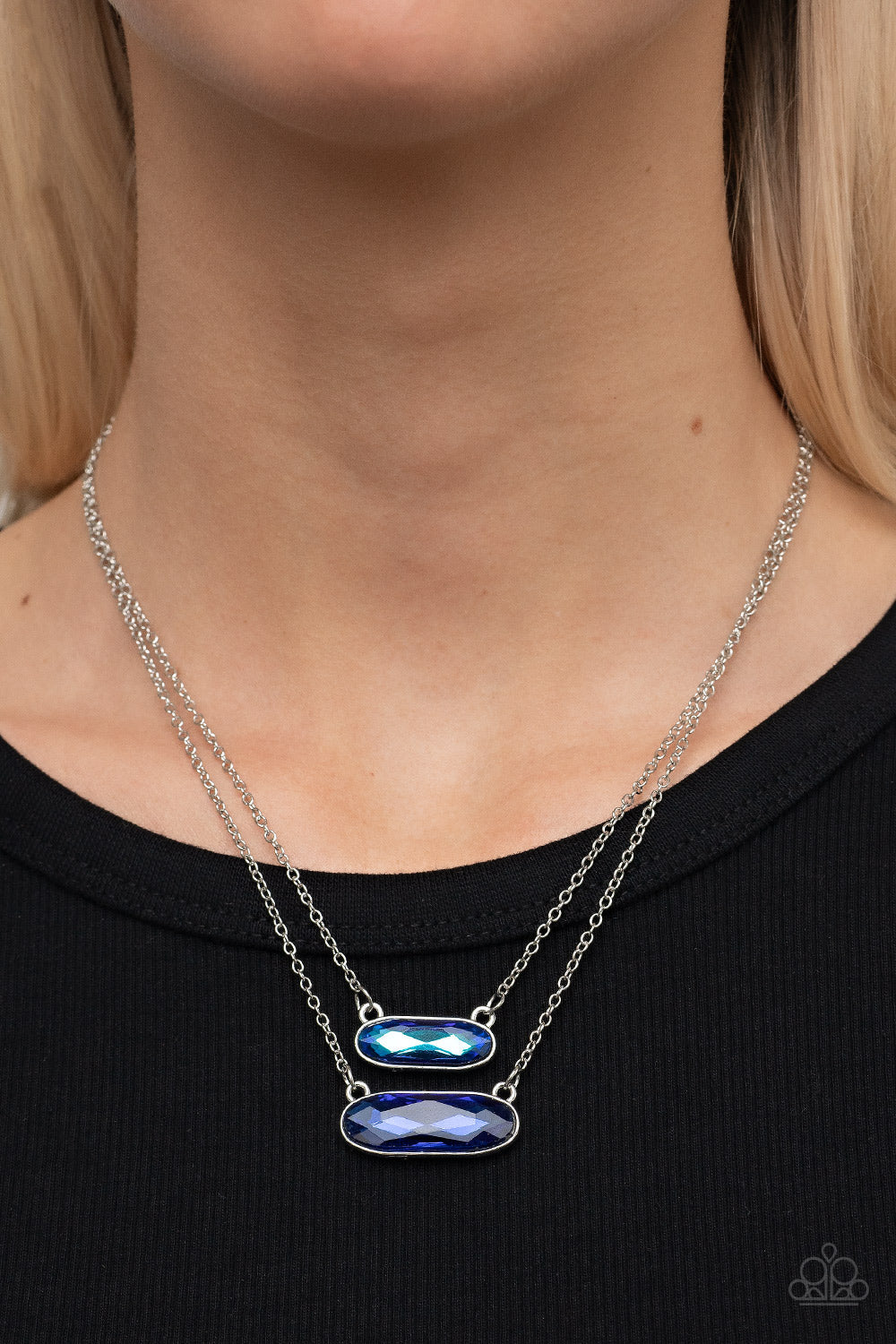 Double Bubble Burst - UV Blue Gem - Silver Necklace - Paparazzi Accessories - UV blue gem is delicately suspended above a slightly larger glittery blue gem below the collar for a stellar double-stacked display.