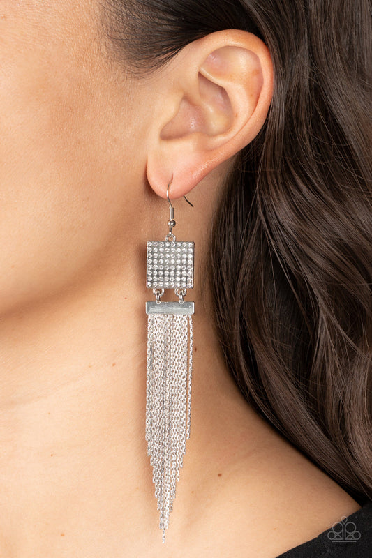 Dramatically Deco - White and Silver Earrings - Paparazzi Accessories - A tapered curtain of flat silver chains cascades from a silver rectangular fitting that delicately links to a silver square frame dotted in dainty white rhinestones, resulting in a trendy tassel.