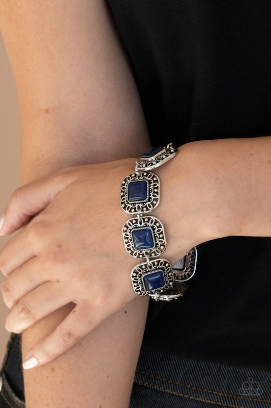 Dreamy Destinations - Blue Cat's Eye and Silver Bracelet - Paparazzi Accessories - 
Dotted with blue cat's eye stones, square filigree filled silver frames delicately link around the wrist for a dreamy display. Features an adjustable clasp closure. Sold as one individual bracelet.
