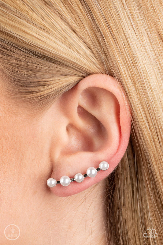 Drop-Top Attitude - White Pearl and Silver Post Crawler Earrings - Paparazzi Accessories - Row of white pearls dots a shiny silver bar that delicately climbs the ear. Features an extended post fitting that climbs the back of the ear and can be pressed together for a more secure fit.