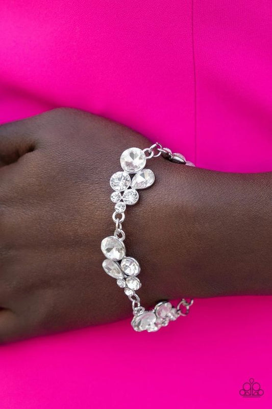 Duchess Dowry - Silver Bling Bracelet - Paparazzi Accessories - White rhinestone encrusted silver bracelet. Adjustable clasp closure bracelet. Paparazzi Accessories Exclusive Item.