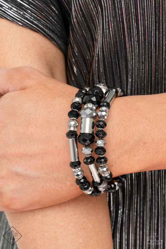 Dynamic Dazzle - Black and Silver - Infinity Wrap Bracelet - Paparazzi Accessories - Stacks of black and silver faceted beads, interspersed with silver cylindrical accents and rhinestone-encrusted beads, are threaded along an infinity wrap-style bracelet making an intensely dynamic statement around the wrist. Sold as one individual bracelet.