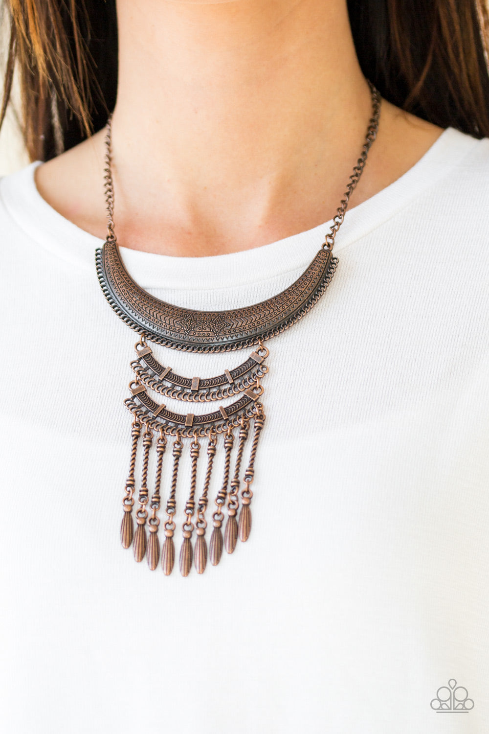 Eastern Empress Copper Necklace - Paparazzi Accessories - Stamped and embossed in tribal inspired patterns, three copper plates connect down the chest, creating a fiercely stacked pendant. Attached to twisted copper rods, ornate copper beads swing from the bottom of the lowermost plate, creating an eye-catching fringe.
