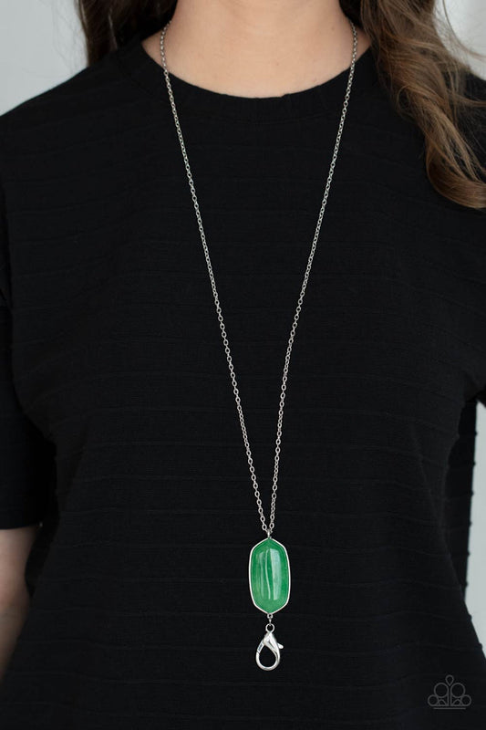 Elemental Elegance - Jade Green and Silver Lanyard Necklace - Paparazzi Accessories - A glassy jade stone swings from the bottom of a lengthened silver chain for an elegantly earthy look. A lobster clasp hangs from the bottom of the design to allow a name badge or other item to be attached.