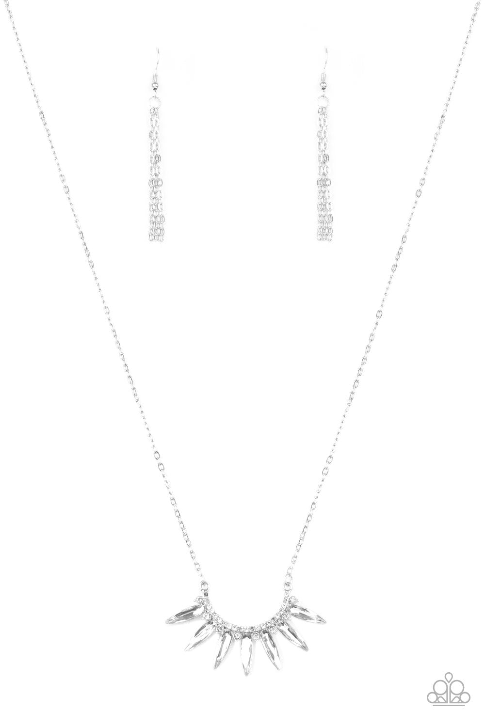 Empirical Elegance - White and Silver Bling Necklace - Paparazzi Accessories - Glassy white gems flare out from the bottom of a bowing silver frame encrusted in glittery white rhinestones. The ornate pendant swings from the bottom of a mid-length silver chain for an edgy-glamorous look. Features an adjustable clasp closure. Sold as one individual necklace. Includes one pair of matching earrings.