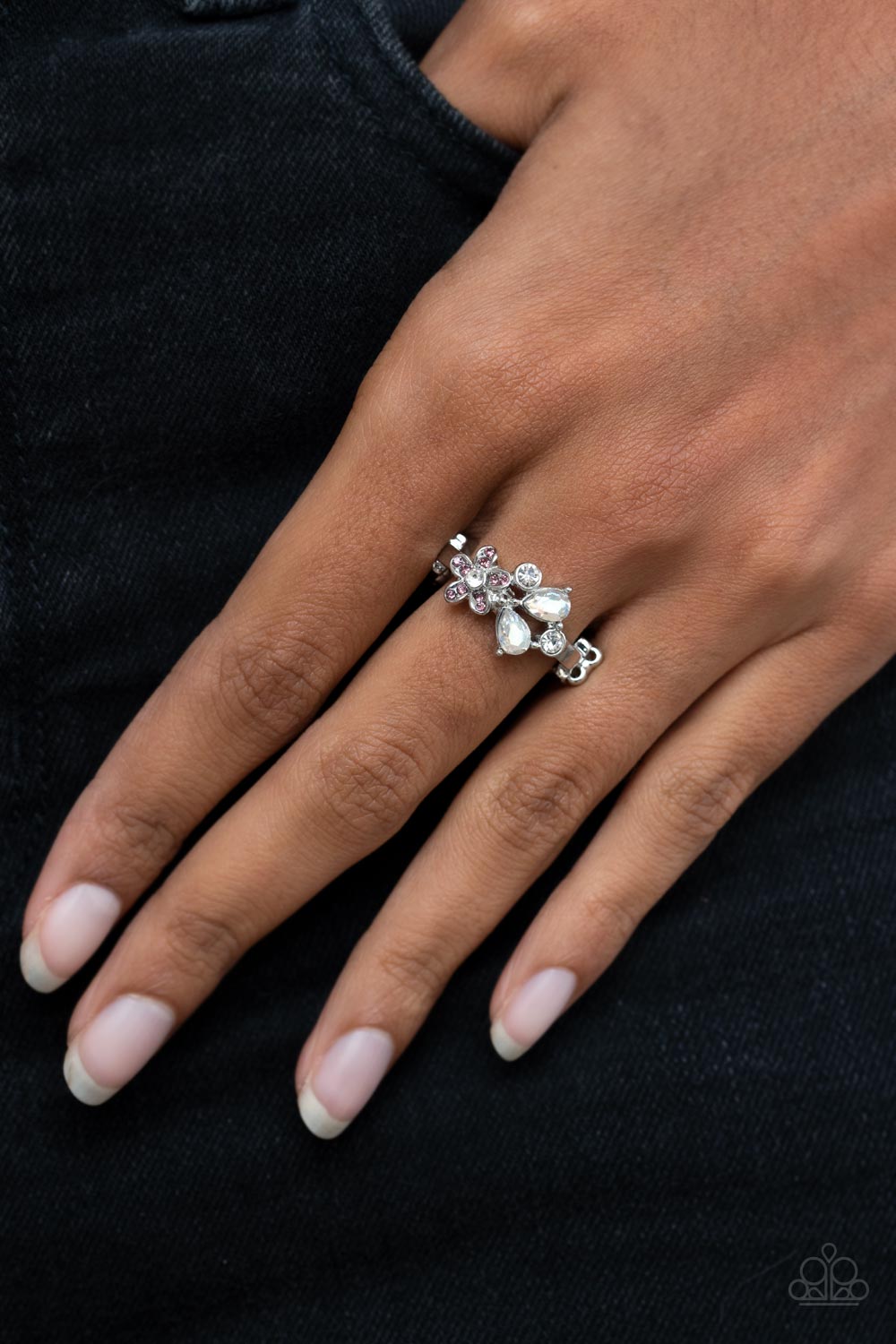 Enchanting Efflorescence - Purple Floral - Silver Ring - Paparazzi Accessories - A purple rhinestone dotted floral frame joins round and teardrop white rhinestones atop a dainty silver band, blooming into an enchanting centerpiece across the finger. Features a dainty stretchy band for a flexible fit. Stylish fashion ring for affordable price.