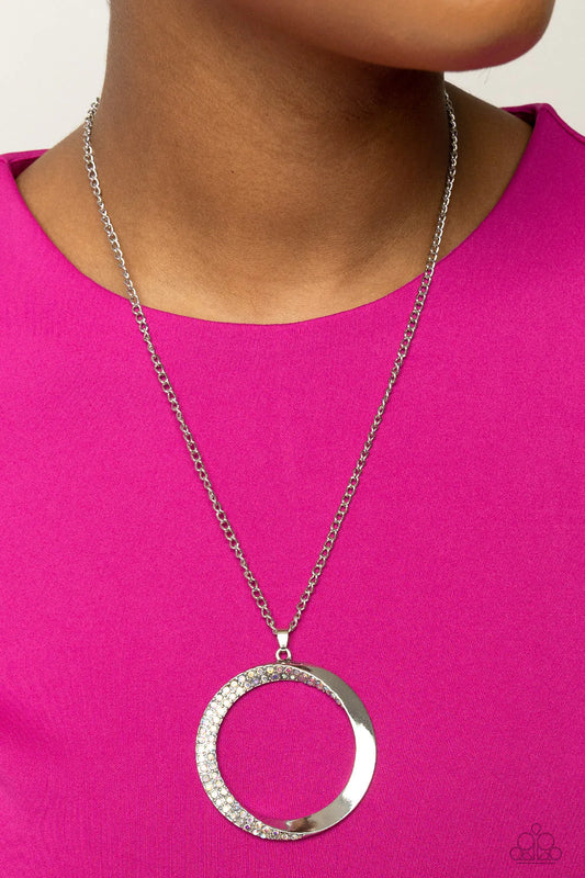 Encrusted Elegance - Multi Color Iridescent and Silver Necklace - Paparazzi Accessories - An airy, oversized, warped, shiny silver hoop dangles down the chest from a classic silver chain. Two rows of dainty iridescent rhinestones encrust along the inner curve of the hoop for an understated, elegant dazzle. Features an adjustable clasp closure. Sold as one individual necklace.